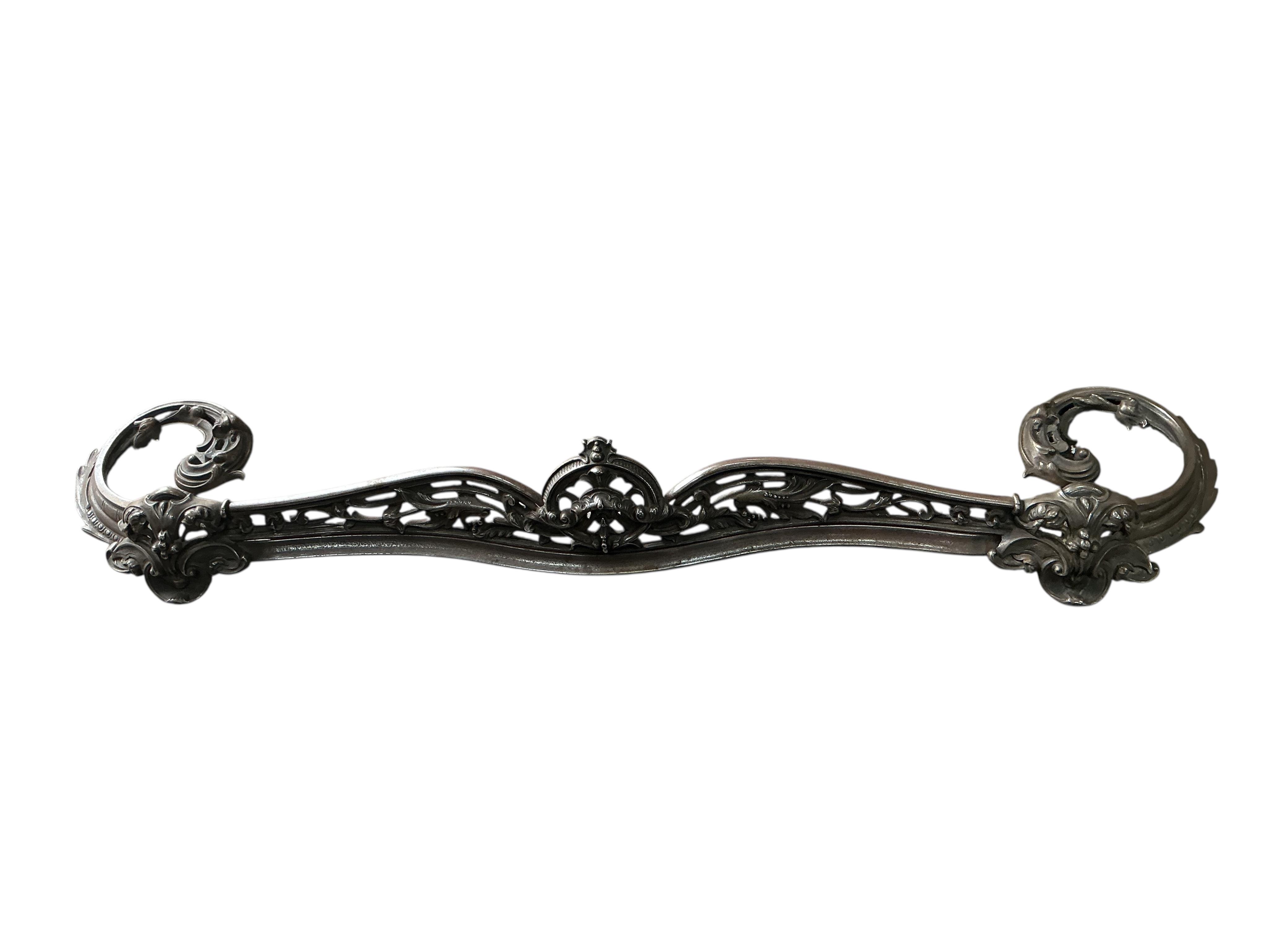 A Victorian polished steel serpentine fender, width 144cm